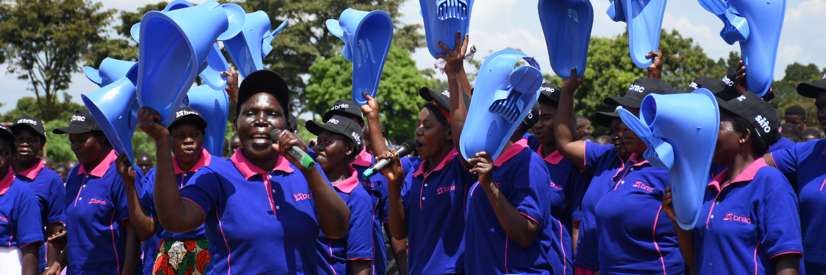 Celebrating World Toilet Day. During World Toilet Day celebrations, the BRAC women hold sanitation products, such as SATO pans. Photo credit: Dorothy Nabatanzi