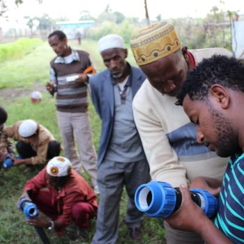Residents of Wita, a small rural community three hours south of Addis Ababa, Ethiopia’s capital, examine infrastructure that will be used to improve the reliability of their water supply. Photo credit: Triple Bottom Line (3BL) Enterprises