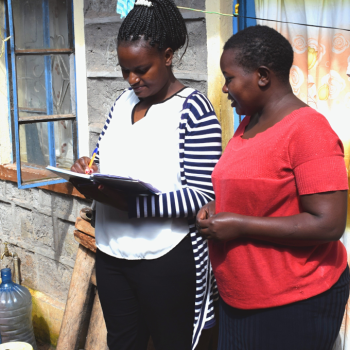A water service provider marketer gets customer feedback from a residential caretaker. Photo credit: Rose Odengo, WASH-FIN
