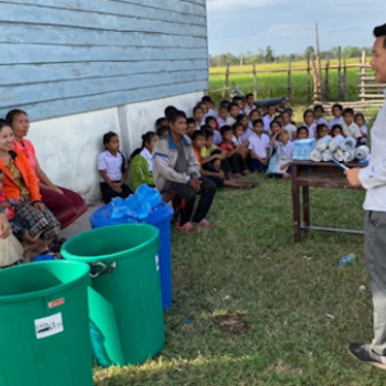 In the Phin District of Laos, Catholic Relief Services (CRS) staff provided hands-on training to school staff and students and Village Education Development Committees on the benefits of clean water and how to use and maintain water filter kits at their schools.  Photo credit: USDA