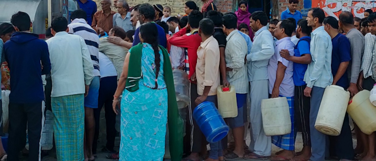 Waiting in line for water should be a thing of the past, not a portent of the future. Photo credit: Shutterstock