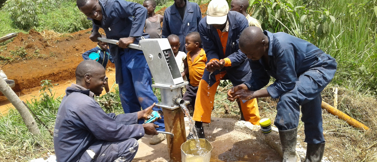 A group of Karabole District hand pump mechanics and artisans repair a hand pump. Credit: IRC