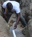 A TEPAC measures free chlorine residual in water sample from a rural drinking water system. Credit: CDC Foundation