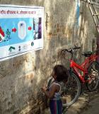 In a Delhi slum, USAID, CARE India, and the New Delhi Municipal Council renovated community toilets with solar light, giving women safe toilet access at night, and promoted behavior change messages to end open defecation. Photo credit: USAID/India