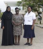 Health care workers (from left to right) Dr. Aisha Mongi, Florence Lughage, and Priscillah Makazi pictured outside the Kilifi County Referral Hospital in Kenya. Photo credit Mwangi Kirubi 