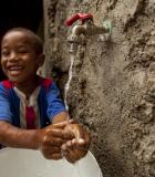 A boy in Cabo Verde washes his hands. Photo credit: MCC