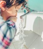boy drinking water; Photo: UsAID